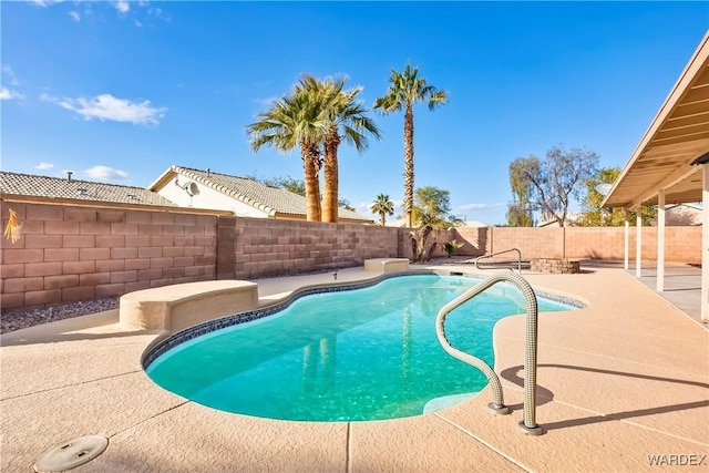 view of swimming pool featuring a fenced in pool, a fenced backyard, and a patio