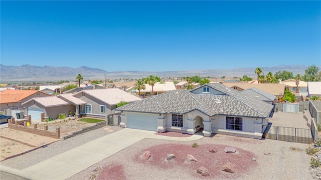2041 E Sundance Dr, Fort Mohave, AZ 86426 - view of front of property with a tile roof, a residential view, a garage, concrete driveway, and stucco siding