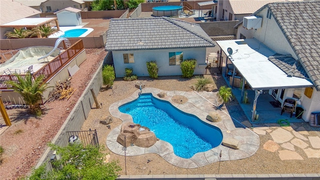 2041 E Sundance Dr, Fort Mohave, AZ 86426 - view of swimming pool featuring a patio area and a fenced backyard