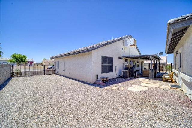 2041 E Sundance Dr, Fort Mohave, AZ 86426 - rear view of property with stucco siding and a patio area