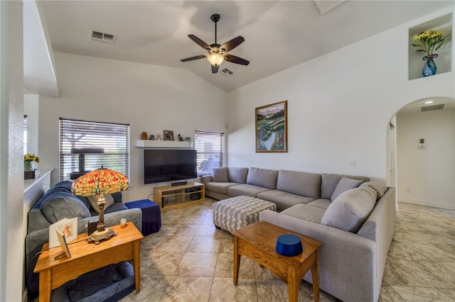 2041 E Sundance Dr, Fort Mohave, AZ 86426 - living room with arched walkways, a ceiling fan, healthy amount of natural light, and high vaulted ceiling