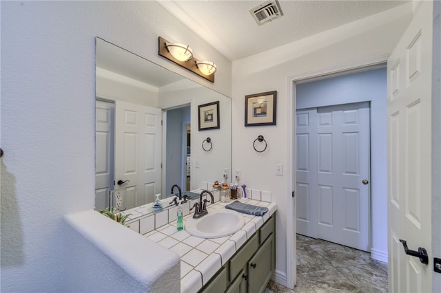2041 E Sundance Dr, Fort Mohave, AZ 86426 - bathroom featuring vanity and a textured ceiling
