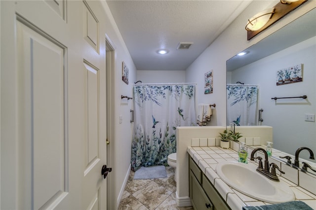 2041 E Sundance Dr, Fort Mohave, AZ 86426 - bathroom with vanity, a shower with curtain, a textured ceiling, and recessed lighting