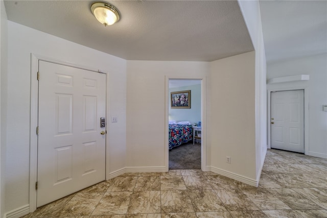 2041 E Sundance Dr, Fort Mohave, AZ 86426 - foyer entrance with baseboards and a textured ceiling