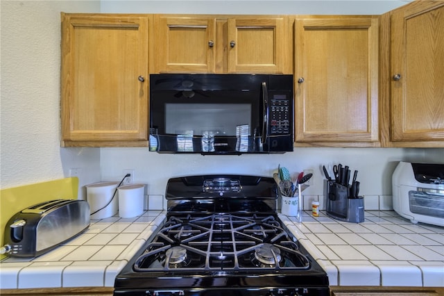 2041 E Sundance Dr, Fort Mohave, AZ 86426 - kitchen with black appliances and tile counters