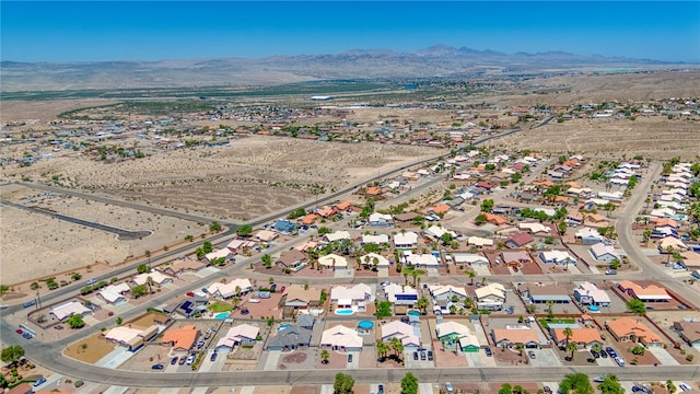 2041 E Sundance Dr, Fort Mohave, AZ 86426 - aerial overview of property's location with a mountainous background and nearby suburban area