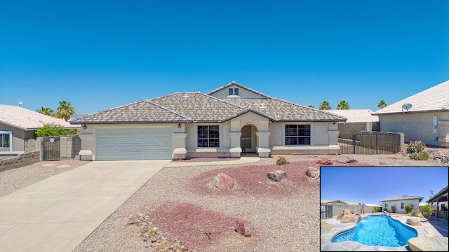 2041 E Sundance Dr, Fort Mohave, AZ 86426 - single story home featuring stucco siding, an attached garage, driveway, and a tiled roof