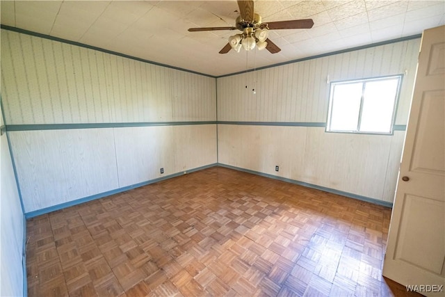 spare room with a ceiling fan