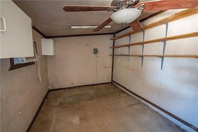 basement featuring ceiling fan and baseboards