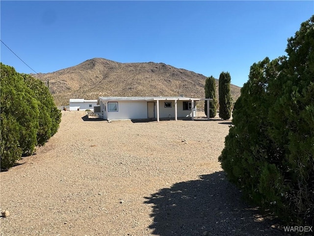 back of house featuring a mountain view