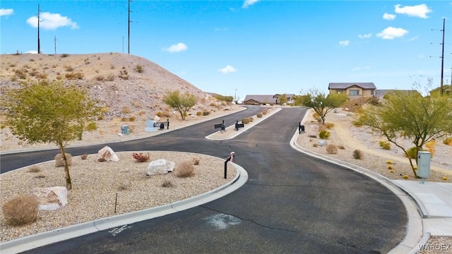 view of road featuring curbs and a mountain view