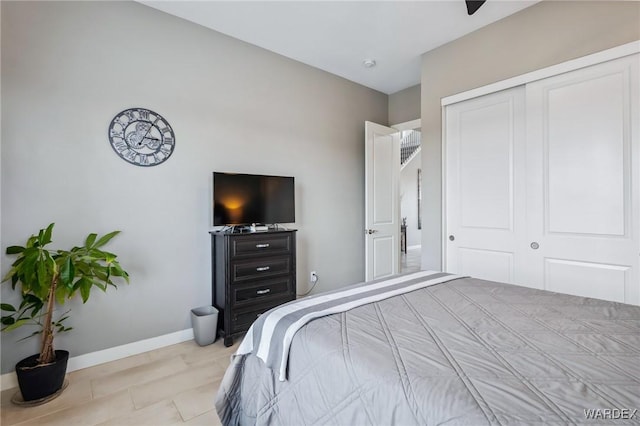 bedroom featuring a closet and baseboards