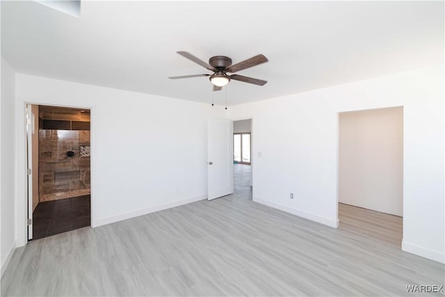 unfurnished room featuring light wood-style floors, ceiling fan, and baseboards