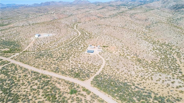 birds eye view of property featuring a mountain view