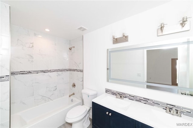 full bathroom with bathtub / shower combination, toilet, vanity, visible vents, and backsplash