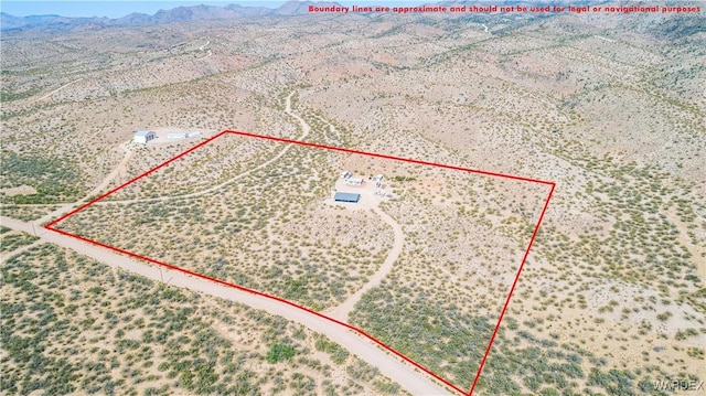 birds eye view of property with a mountain view