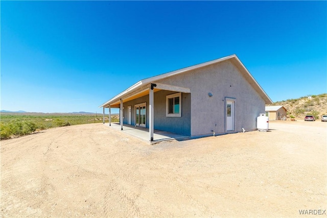 view of property exterior featuring a patio and stucco siding