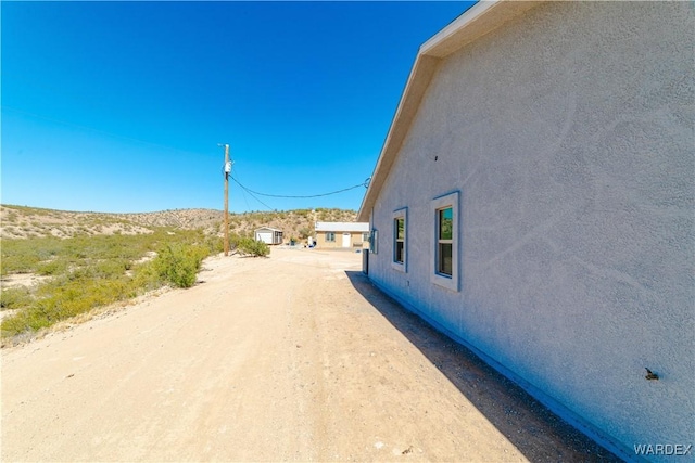 view of road with driveway