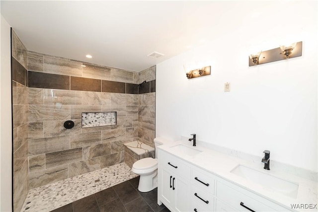 full bathroom with tile patterned flooring, a sink, toilet, and double vanity