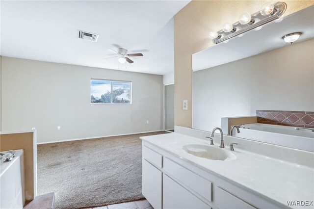 full bath featuring a bath, visible vents, a ceiling fan, and vanity