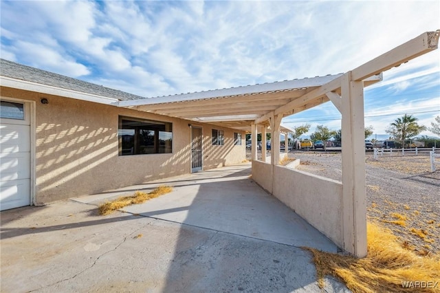 view of patio featuring fence