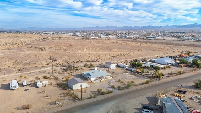 aerial view featuring view of desert and a mountain view