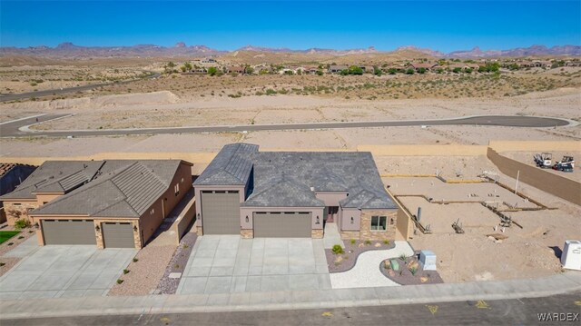 aerial view with a desert view and a mountain view