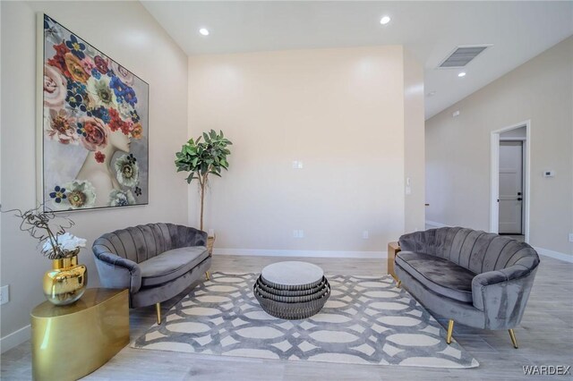 sitting room featuring recessed lighting, light wood-type flooring, visible vents, and baseboards