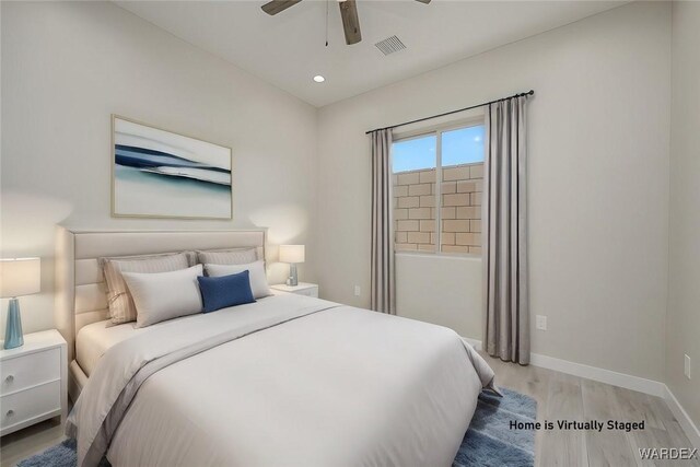 bedroom featuring ceiling fan, recessed lighting, visible vents, baseboards, and light wood-type flooring