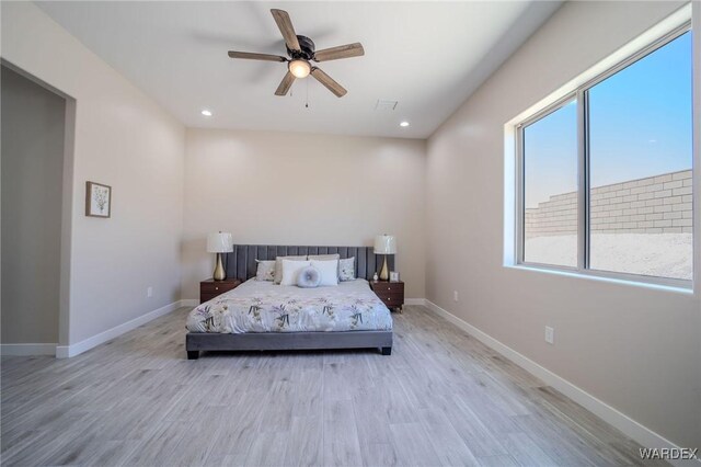 bedroom with ceiling fan, recessed lighting, light wood-style flooring, and baseboards