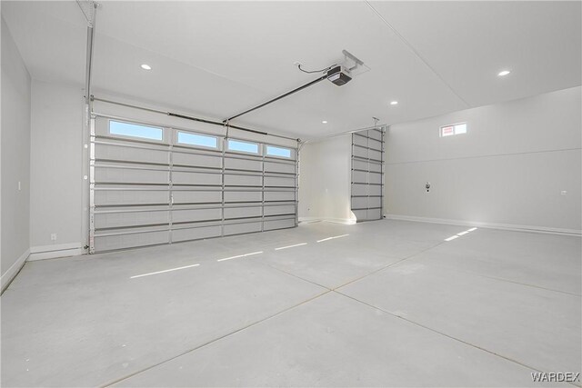 garage featuring baseboards and a garage door opener