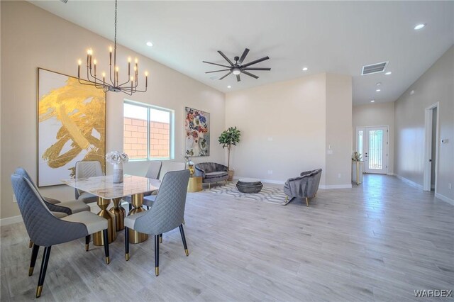 dining space featuring light wood-style floors, recessed lighting, visible vents, and plenty of natural light