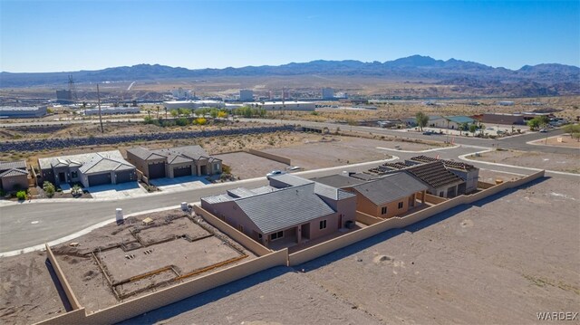 drone / aerial view featuring a residential view and a mountain view