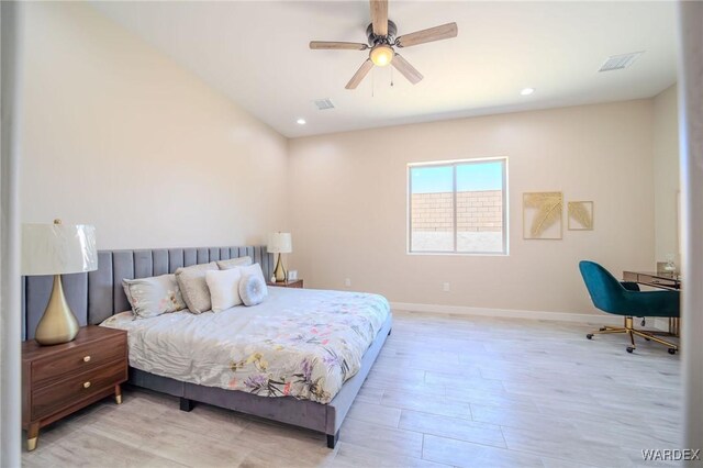 bedroom with light wood-type flooring, visible vents, baseboards, and recessed lighting