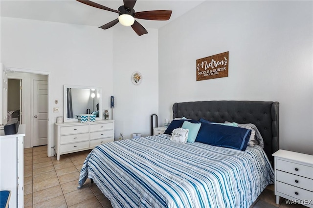 bedroom with ceiling fan and light tile patterned flooring