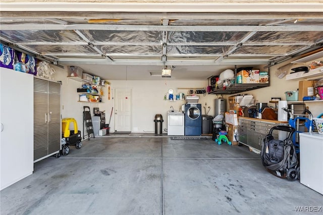 garage featuring separate washer and dryer and a garage door opener