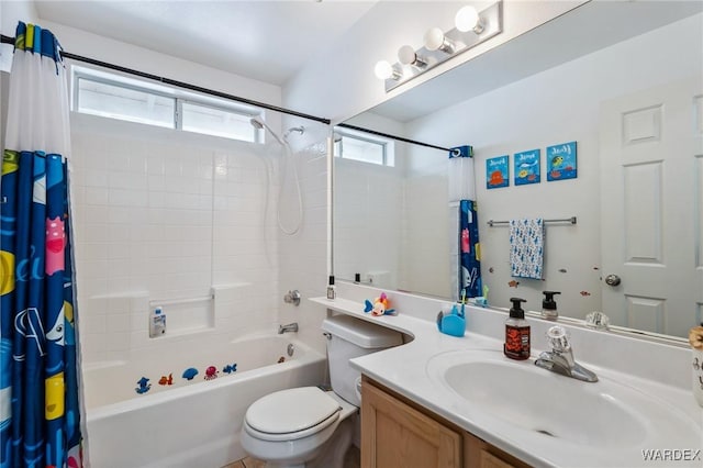 bathroom with toilet, shower / bath combo, and vanity