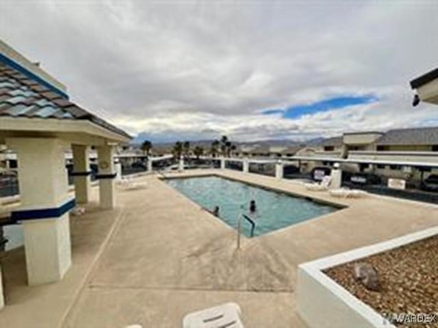 outdoor pool featuring a patio