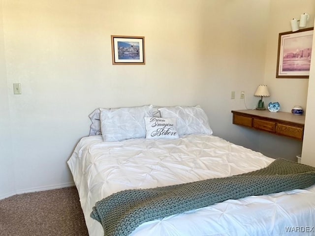 bedroom with carpet flooring and baseboards