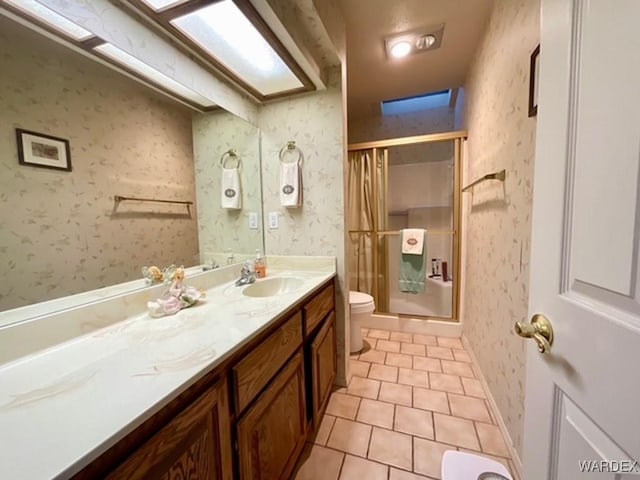 full bathroom featuring toilet, wallpapered walls, tile patterned flooring, and a stall shower