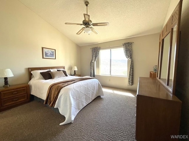 bedroom with lofted ceiling, light carpet, ceiling fan, and a textured ceiling