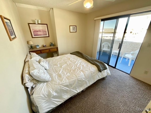 carpeted bedroom featuring a textured ceiling, access to outside, and a ceiling fan