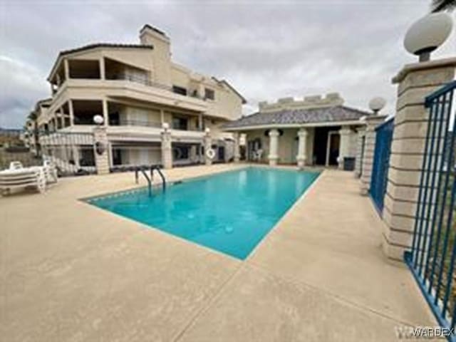 pool featuring a patio area