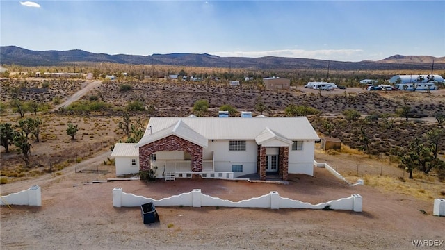 birds eye view of property with a mountain view