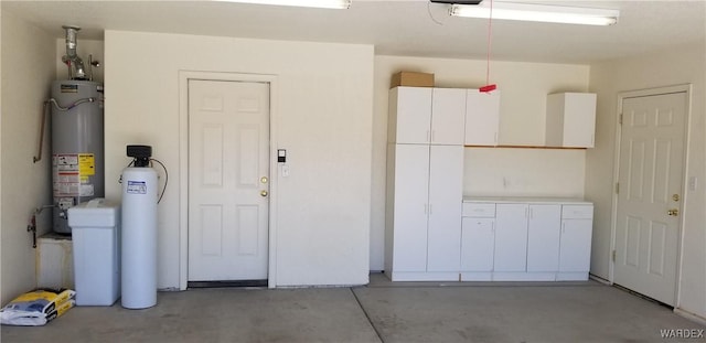 garage featuring gas water heater