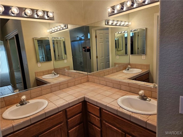 bathroom featuring double vanity and a sink