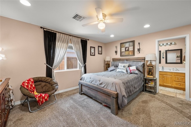 carpeted bedroom featuring recessed lighting, visible vents, ensuite bathroom, a ceiling fan, and a sink