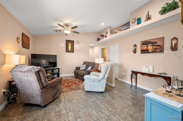 tiled living area featuring baseboards and a ceiling fan