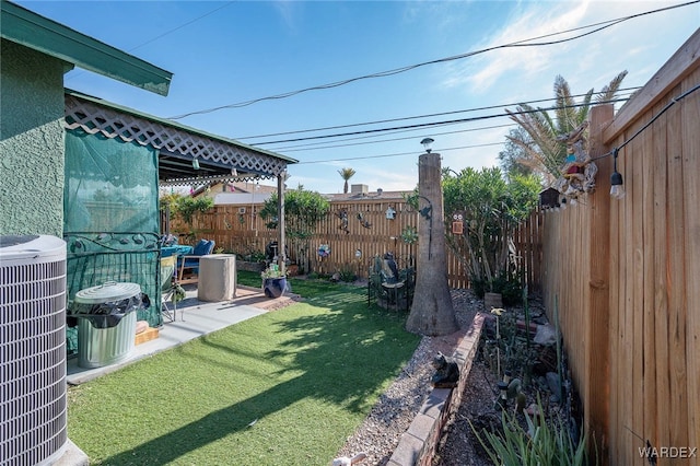 view of yard featuring a fenced backyard and cooling unit