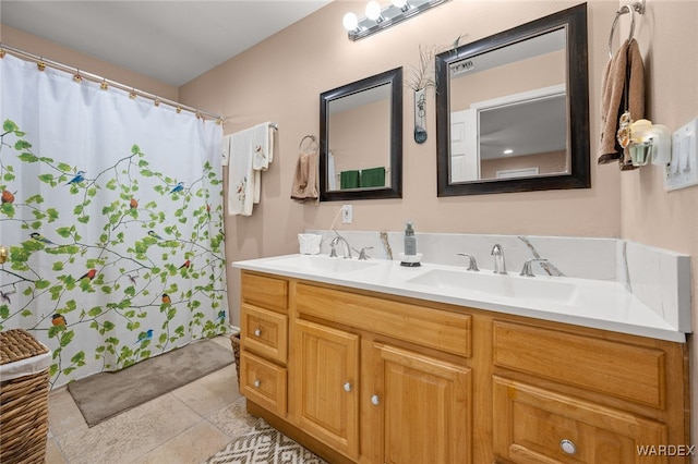 full bath featuring double vanity and a sink